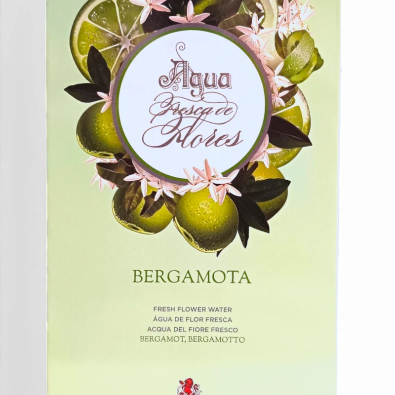 Lata rectangular de Alvarez Gomez Bergamota EDT 175ml Lata ed., decorada con frutos de bergamota, hojas verdes y flores rosas sobre un fondo verde pálido.