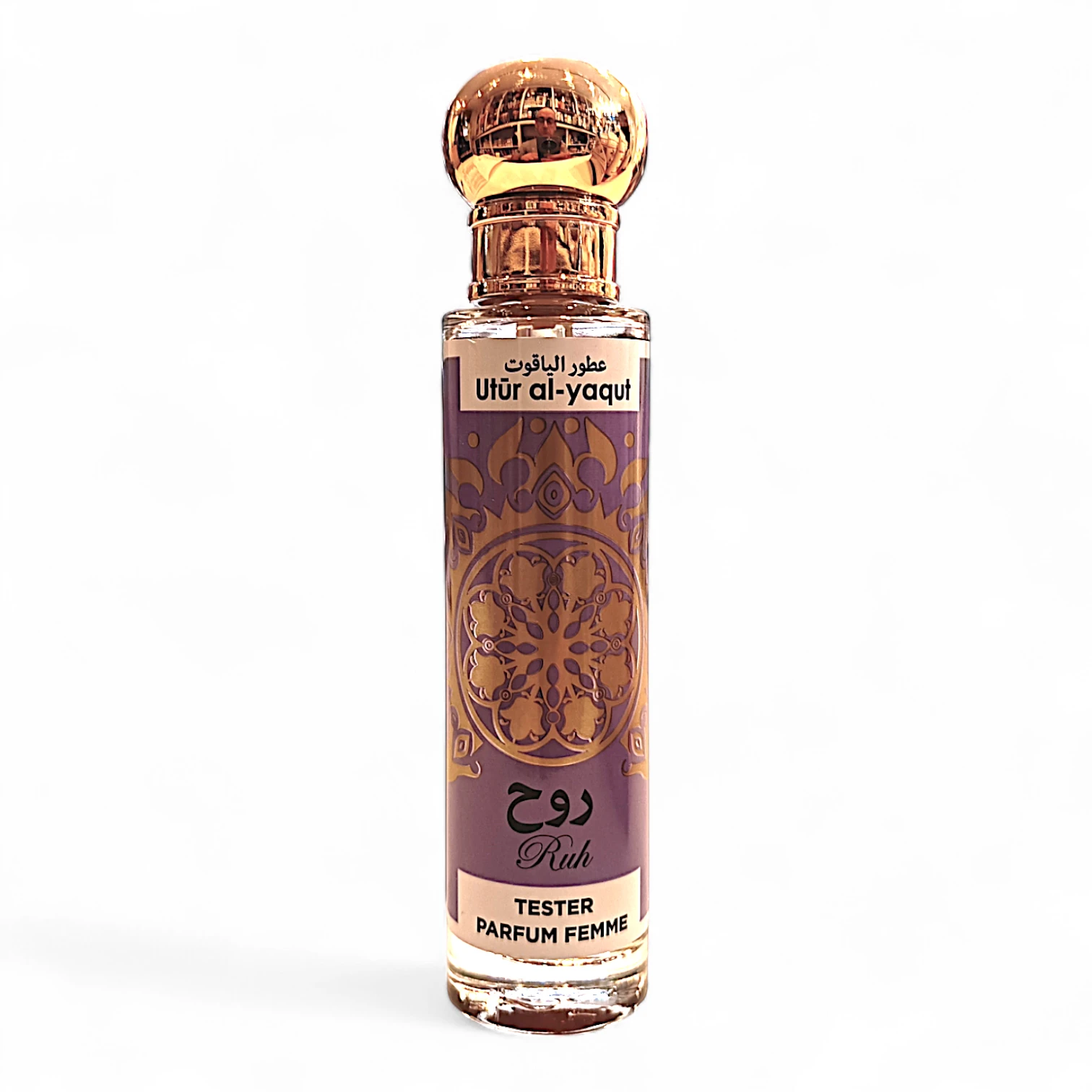 Frasco de 30 ml de Utür al-yaqut Ruh mujer EDP con tapón dorado y etiqueta morada con texto en árabe e inglés, "Tester Parfum Femme", y un intrincado diseño dorado.