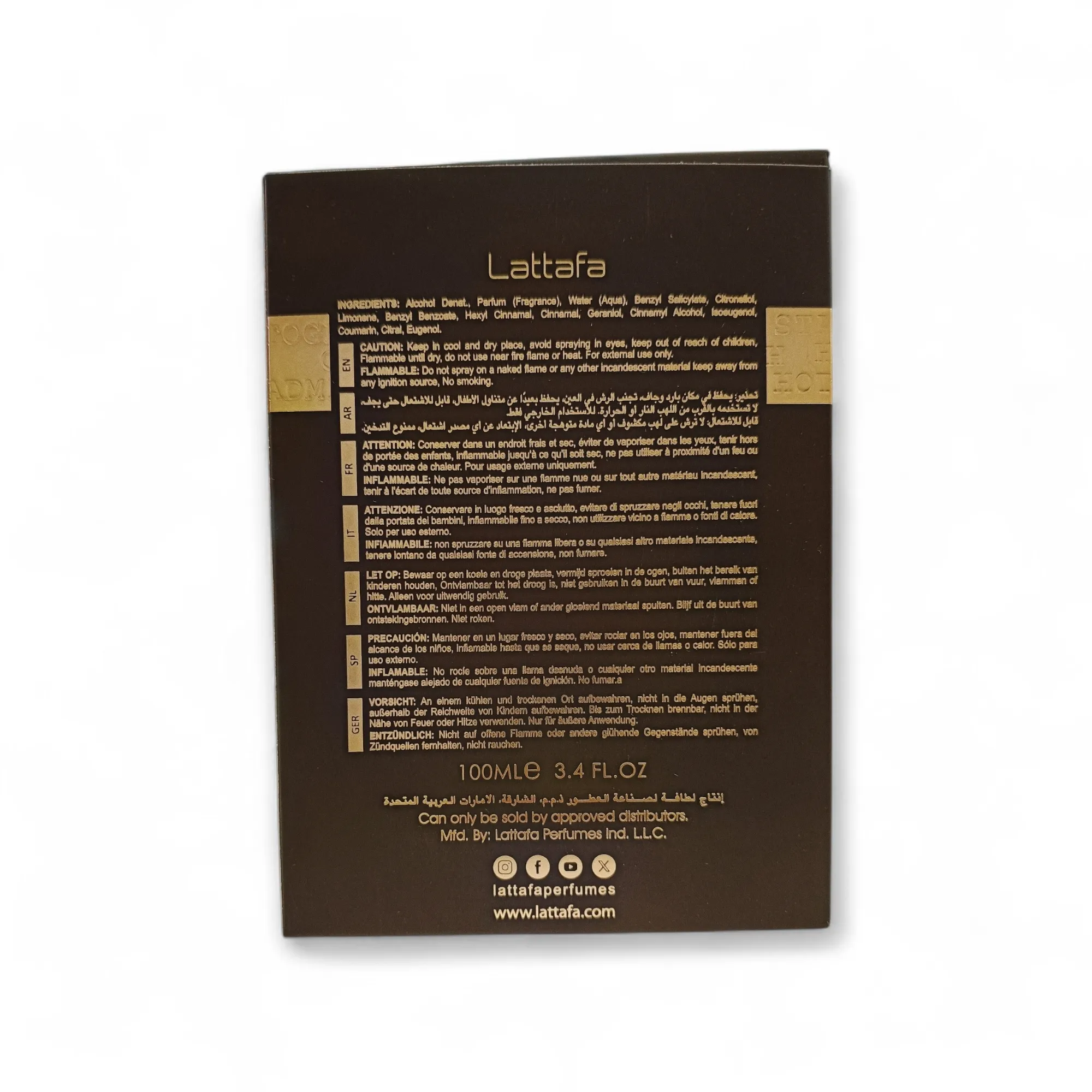 Reverso de una caja de perfume Lattafa con ingredientes, precauciones, datos del fabricante y volumen (100 ml) impresos en dorado y blanco sobre fondo marrón oscuro.