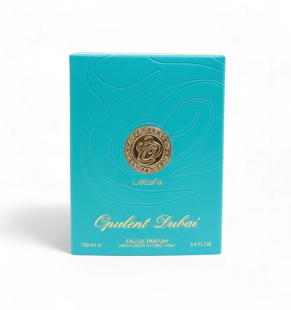 Una caja turquesa de Lattafa Opulent Dubai Eau de Parfum, con un emblema dorado y un elegante texto dorado. La caja contiene 100 ml y presenta un estampado de remolinos en relieve.