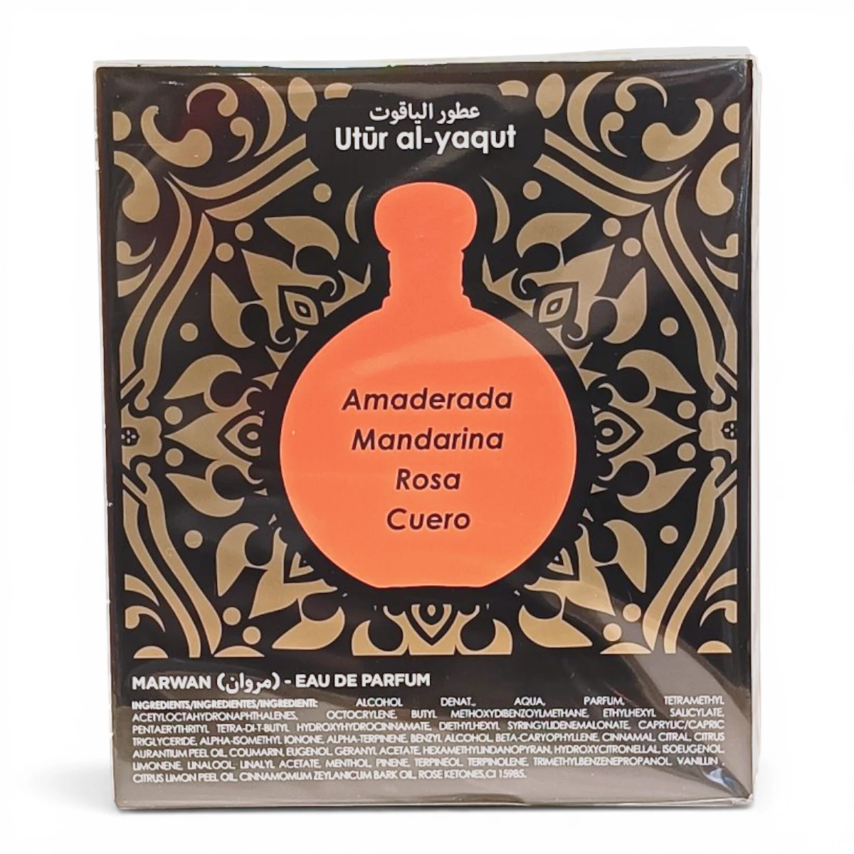 Caja de perfume con motivos ornamentales en negro y dorado, con la silueta de un frasco naranja etiquetado Amaderada Mandarina Rosa Cuero y la marca Utur al-yaqut en árabe e inglés en la parte superior.