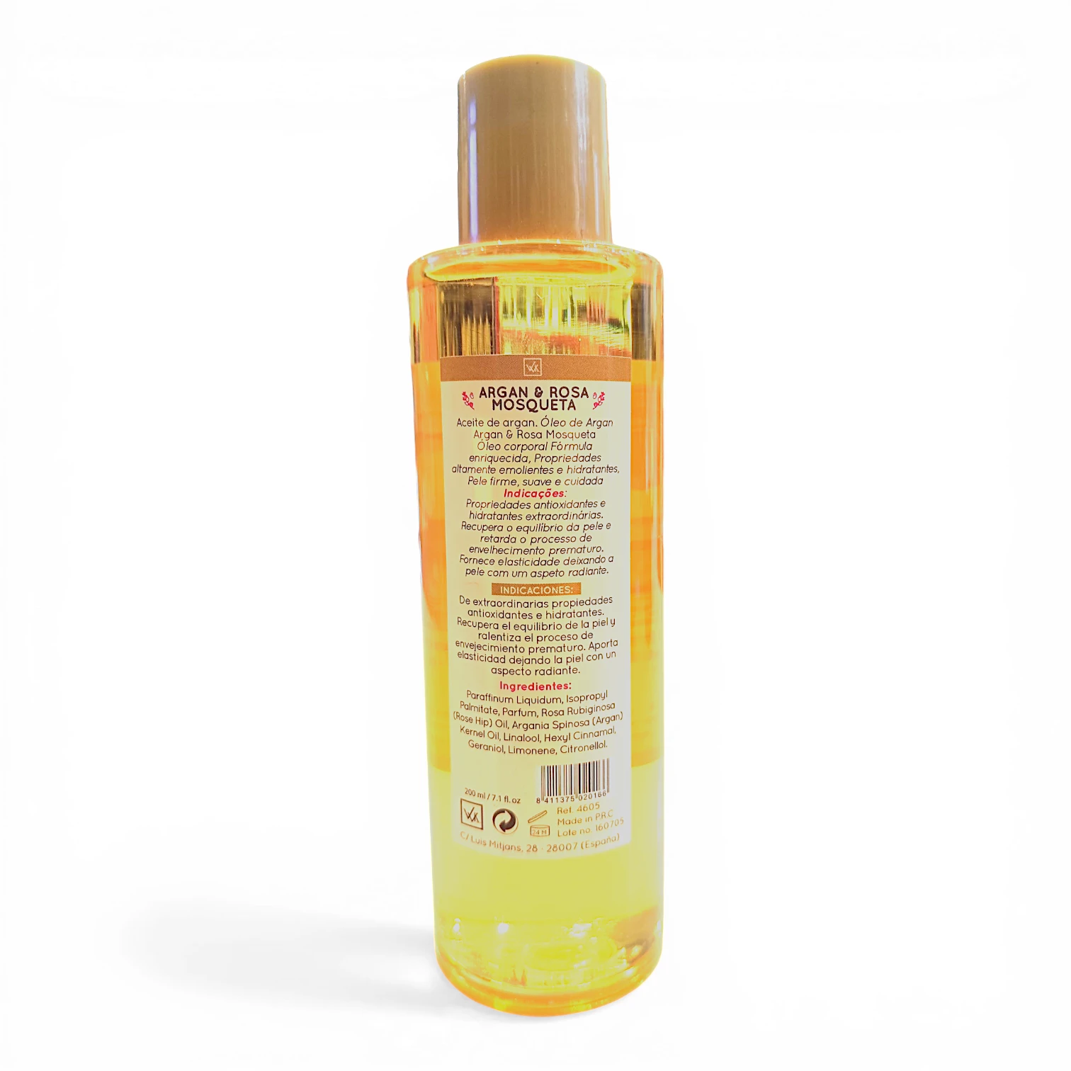 Botella de plástico transparente llena de líquido amarillo, con tapón beige. La contraetiqueta muestra información del producto sobre una mezcla de aceite de argán y rosa mosqueta en español, con ingredientes e instrucciones visibles.