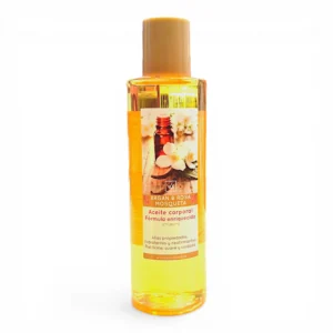 Botella de plástico transparente con tapón amarillo que contiene líquido dorado. La etiqueta dice Argán & Rosa Mosqueta Aceite corporal Fórmula enriquecida y muestra una imagen de nueces de argán, escaramujos y un frasco marrón.