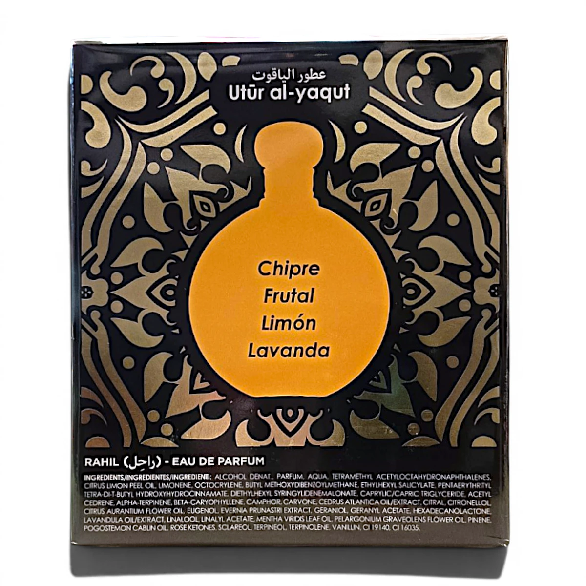 Caja de perfume negra con motivos decorativos dorados, con la silueta de un frasco naranja dorado en el centro. El texto del frasco menciona Chipre, Frutal, Limón, Lavanda. La marca Utûr al-yaqut aparece en la parte superior.