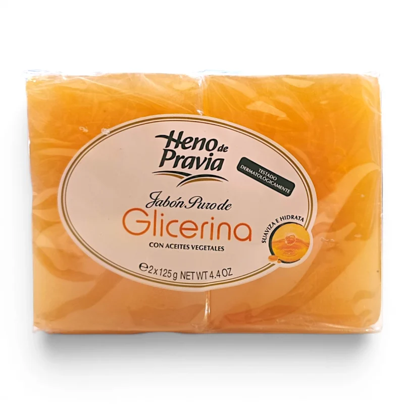 Una botella de Jabón 100 % natural de glicerina vegetal Lida de 500 ml, elaborado con glicerina vegetal. Envasado en una botella de plástico transparente con una etiqueta blanca, detalles dorados y texto en español de color naranja que destaca sus propiedades hidratantes.
