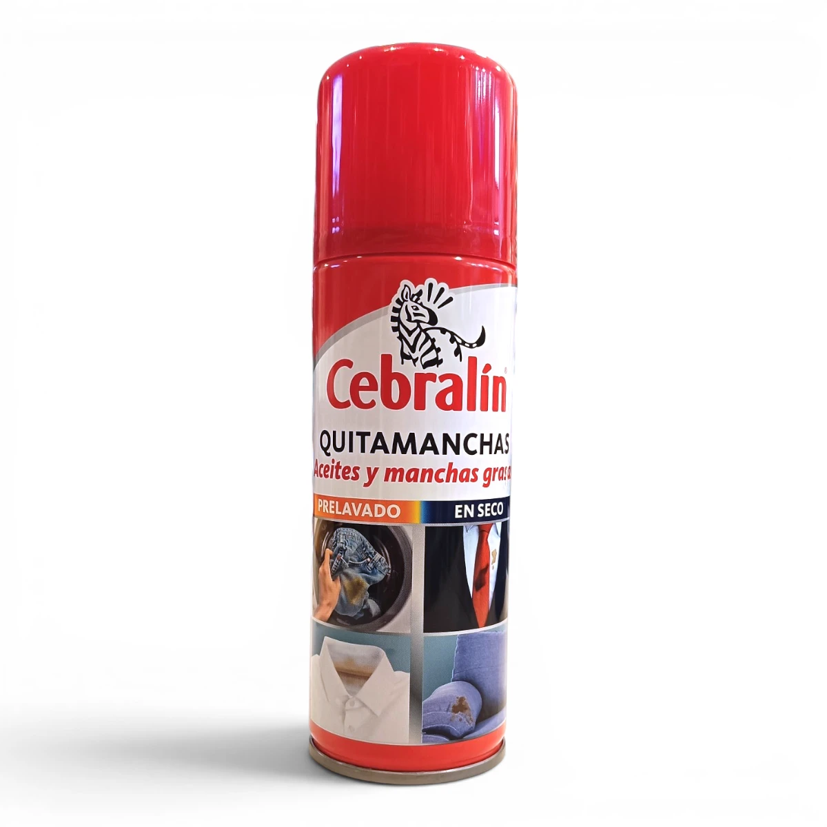 Una lata roja de Cebralín, un spray quitamanchas, indicada para eliminar manchas de aceite y grasa. En la parte delantera aparecen imágenes de ropa manchada y un texto en español en el que se destacan sus usos y métodos de aplicación.