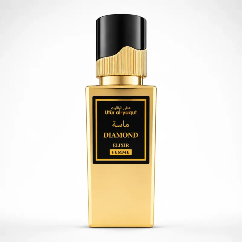 Un frasco de perfume rectangular de color dorado con un tapón negro y dorado. En la etiqueta se lee «Utur al-yaqut Diamond Elixir Femme» en inglés y árabe, sobre un fondo negro con detalles dorados.